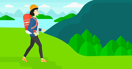 Image showing Woman with backpack hiking.