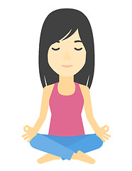 Image showing Woman meditating in lotus pose.