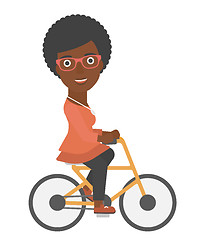 Image showing Woman cycling to work.