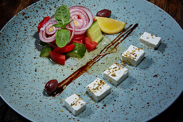 Image showing Fresh Greek salad in a bowl,