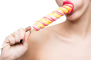 Image showing Close-up shot of woman\'s mouth bright red lips with lollipop. blowjob simulation