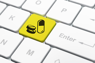 Image showing Health concept: Pills on computer keyboard background