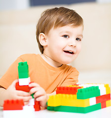 Image showing Boy is playing with building blocks