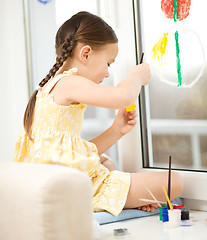 Image showing Portrait of a cute girl playing with paints