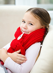 Image showing Ill little girl with thermometer in her mouth