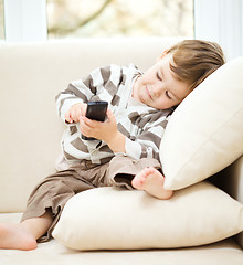 Image showing Little boy is watching tv