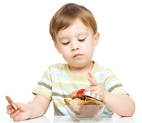 Image showing Portrait of a boy with cookies