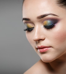 Image showing Close up portrait of beautiful young woman face. Makeup concept.