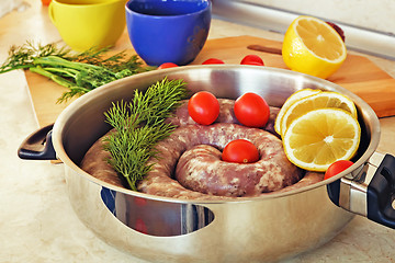 Image showing Homemade pork sausage in a frying pan for a roast.