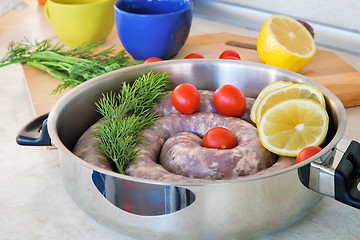 Image showing Homemade pork sausage in a frying pan for a roast.