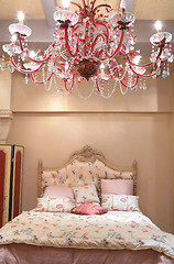 Image showing bedroom with red chandelier