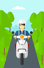 Image showing Man riding scooter.