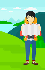 Image showing Backpacker looking at map.