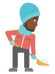 Image showing Man shoveling and removing snow.