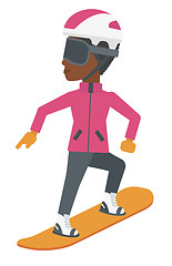 Image showing Young woman snowboarding.