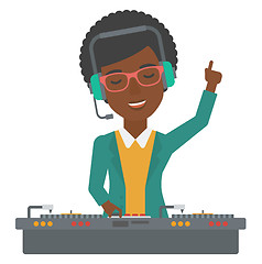 Image showing Smiling DJ with console.