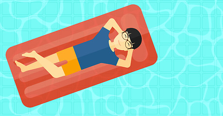 Image showing Man relaxing in swimming pool.