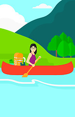 Image showing Woman canoeing on the river.