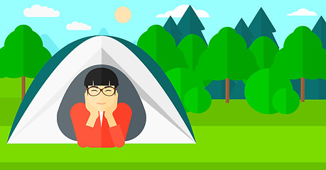 Image showing Man lying in tent.