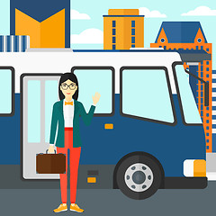 Image showing Woman standing near bus.