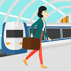 Image showing Woman going out of train.