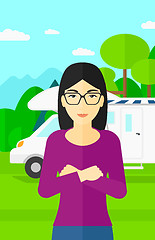 Image showing Woman standing in front of motor home.