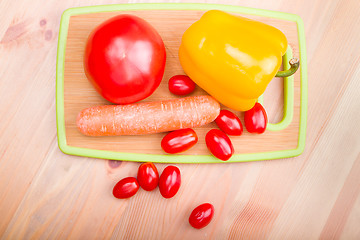 Image showing tomato paprika carrot on wooden board