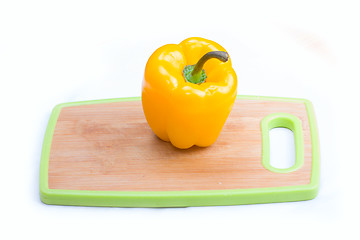 Image showing yellow  paprika on wooden board