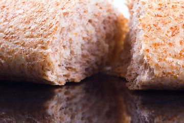 Image showing Breaking Bread on a dark glass background