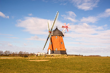 Image showing Old mill on a green meadow