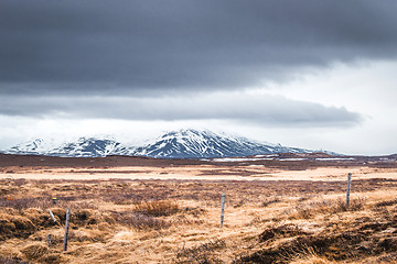 Image showing Fence on a field with mountains