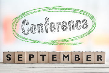 Image showing September conference sign with green sketch