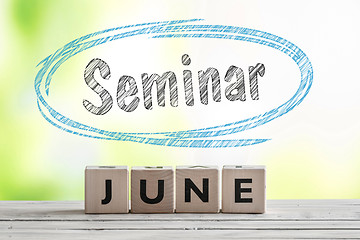 Image showing June seminar sign on a wooden stage