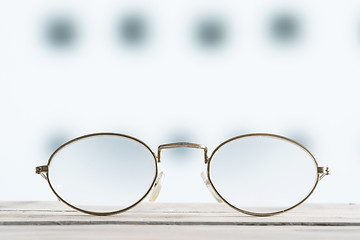 Image showing Glasses on a table with blurry background