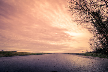 Image showing Road made of asphalt in the sunset