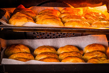 Image showing Buns in a hot oven