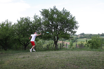 Image showing Young man with frisbee