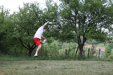 Image showing Young man with frisbee