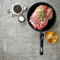 Image showing raw marinated meat on cooking pan