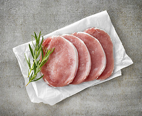 Image showing fresh raw pork on white wrapping paper