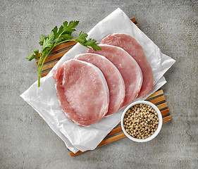 Image showing fresh raw pork on white wrapping paper