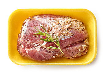 Image showing raw marinated pork tenderloin in plastic try