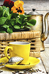 Image showing tea and flower pansy