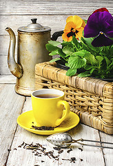 Image showing tea and flower pansy