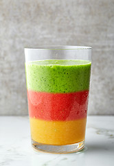 Image showing glass of multicolored smoothie