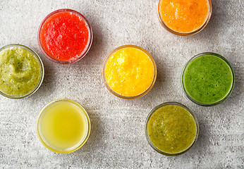 Image showing various smoothies on gray kitchen table