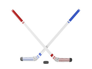 Image showing Ice hockey sticks and puck