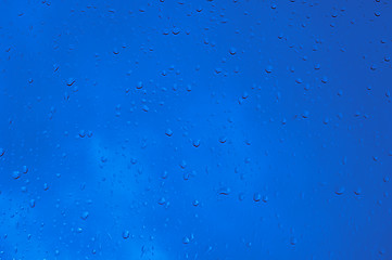 Image showing Blue water drops on window