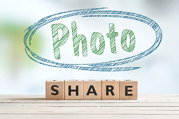 Image showing Share photo sign on a desk