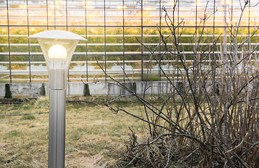 Image showing Lamp outside af greenhouse